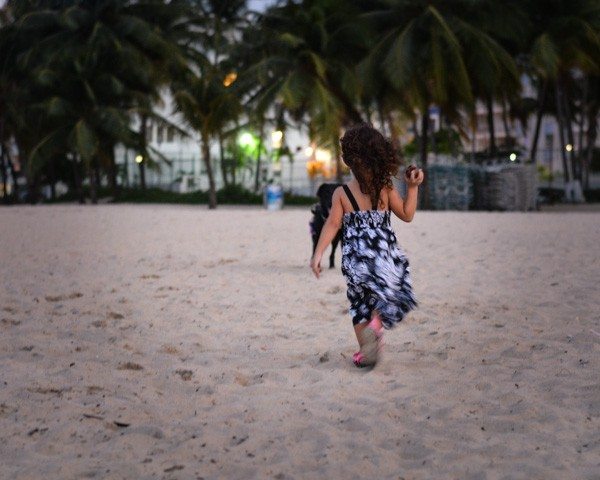 Toddler Throwing a Coconut