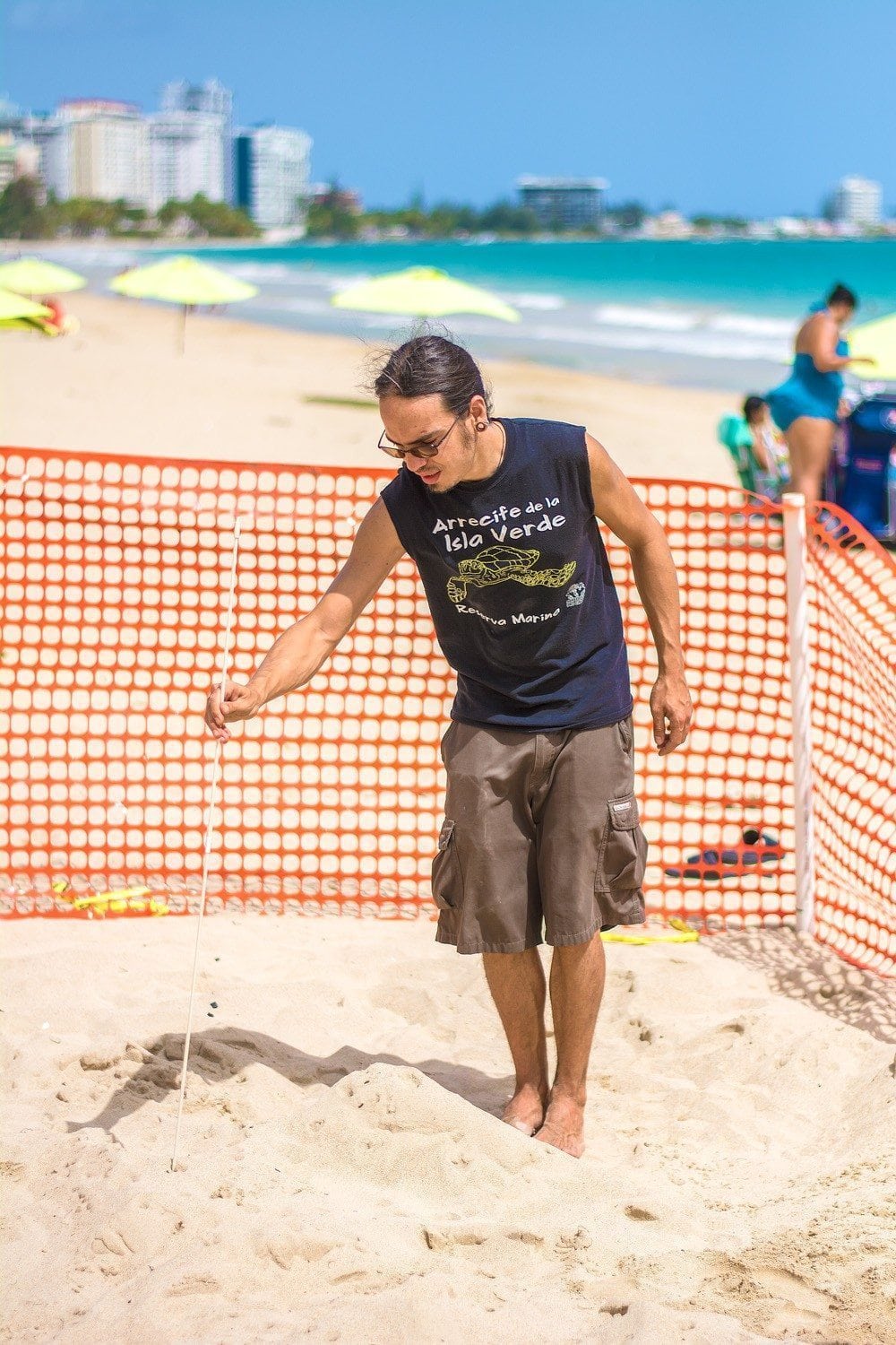 Diego prodding to make sure they are protecting the complete turtle nest. 