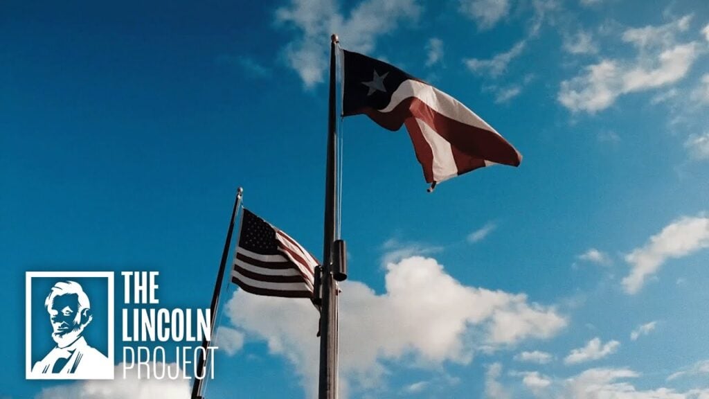 Puerto Rican and American flags waving against a blue sky with The Lincoln Project logo in the corner.