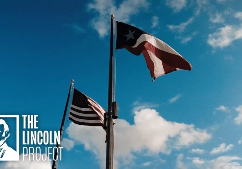 Puerto Rican and American flags waving against a blue sky with The Lincoln Project logo in the corner.