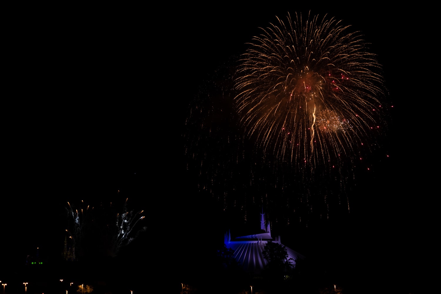Fireworks and Tomorrowland and Space Mountain at Night - Disney’s Magic Kingdom